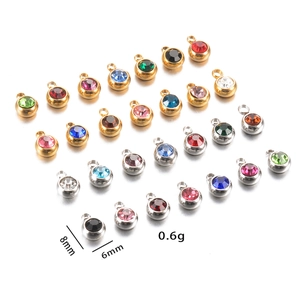 Macro view of 6mm birthstone charms with gold and silver claw settings for DIY jewelry
