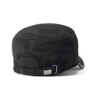 Detail of winter thermal flat cap with black camo texture and metal logo badge