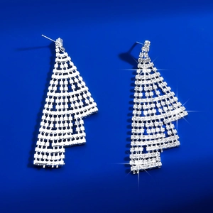 Detailed view of silver rhinestone tassel earrings with a luxurious shimmering finish