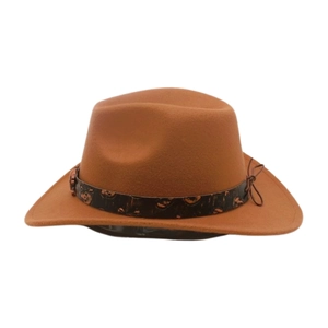 Detail of tan felt cowboy hat featuring black skull pattern band and braided side knot