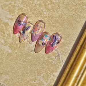 Macro view of purple butterfly nail stickers with 3D pearls and glitter gradient detail