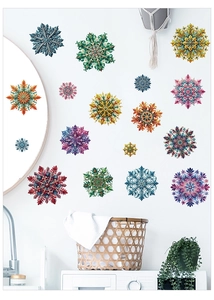 Colorful mandala snowflake wall stickers displayed on a bright laundry room white wall