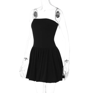 Close-up of black strapless mini dress featuring high waist and pleated skirt details