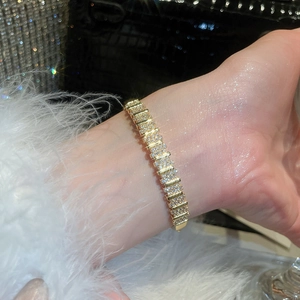 Detailed view of 18k gold plated bracelet featuring pave-set cubic zirconia on wrist