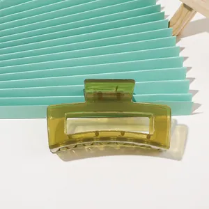 Close-up of olive green translucent acrylic hair claw with hollow rectangular design