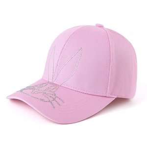 Detail of pink cotton baseball cap featuring silver rhinestone rabbit motif decoration