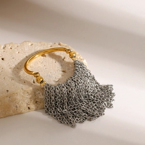 Two-tone gold ring with silver metal tassels on stone, elegant stainless steel jewelry