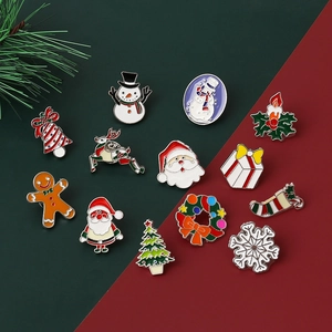 Christmas enamel pin set with 12 holiday designs like Santa, snowman, and reindeer
