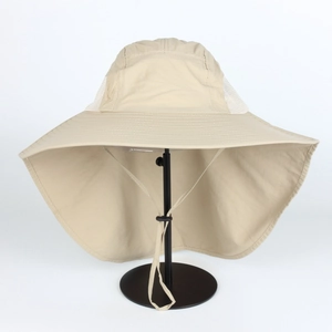Detail of outdoor sun hat featuring wide brim, neck protection flap, and breathable mesh
