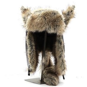 Detailed view of brown faux fur trapper hat with decorative ears and plush tail accessory