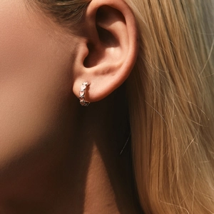 Elegant S925 sterling silver heart hoop earrings worn on model for a sweet trendy look