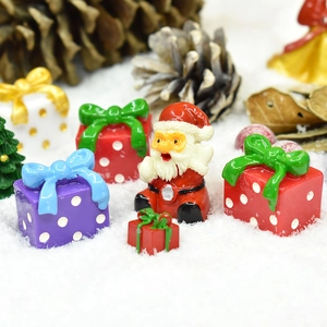 Miniature Christmas resin set with Santa Claus, colorful gift boxes and a small Xmas tree