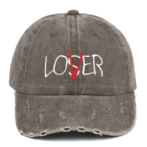 Detail of washed charcoal grey baseball cap showing distressed holes and loser embroidery
