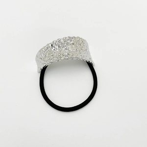 Detail of silver irregular pleated metal piece on black high-elastic punk style hair tie
