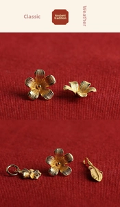 Detailed macro of gold plated S925 silver flower and feather charms in ancient gold style