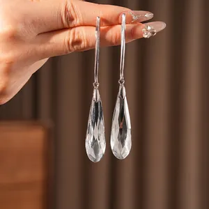 Elegant long silver drop earrings featuring faceted clear crystal pendants for women