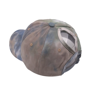 Tie-dye ponytail baseball cap with blue green patterns and adjustable rear opening