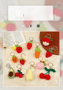 Detail of handmade crochet fruit and vegetable keychains on elegant lace background
