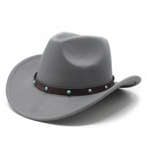 Detail of grey wool cowboy hat with brown leather band and turquoise studs embellishments