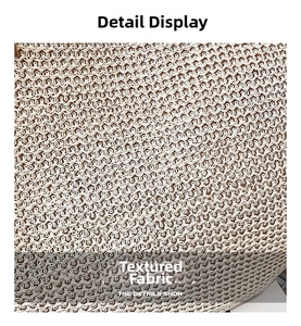 Detailed macro view of the cream woven texture and geometric mesh pattern of the straw bag