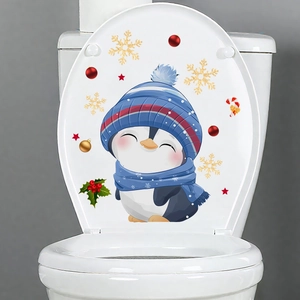 Detail of Christmas toilet sticker with cute penguin, snowflakes, and festive candy cane