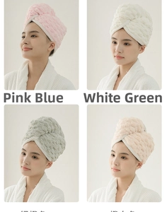 Close-up of thick coral fleece hair drying towels with cloud grid pattern and button detail