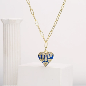 Gold-plated chain necklace with blue heart pendant and dripping zircon details