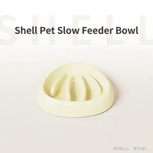Shell shaped slow feeder dog bowl in cream yellow color for preventing choking