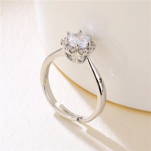 Silver snowflake zircon ring with adjustable band shown at a 45-degree angle view