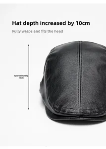 Detail of black faux leather flat cap showing 10cm depth and fine stitching texture