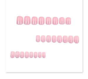 Detailed flat lay of 24pcs short square French gradient nails with gold glitter tips