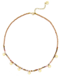 Detail of beaded necklace with gold discs and stainless steel clasp on white background