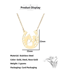 Detail view of 21mm gold stainless steel horseshoe pendant with equestrian engraving