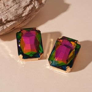 Macro shot of rectangular multi-color crystal earrings with gold prong settings