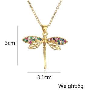 Detail view of 18K gold plated dragonfly pendant with dimensions 3cm x 3.1cm and weight 6g