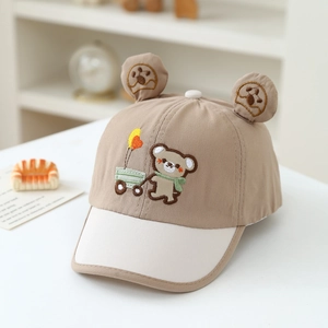 Detailed view of baby baseball cap featuring 3D bear ears and cute cartoon embroidery
