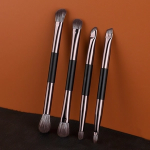 Set of 4 dual-ended makeup brushes with rose gold metal handles for eye shadow and concealer