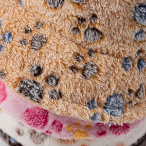 Winter plush bucket hat with colorful pet paw prints and fluffy fleece lining texture