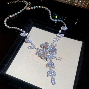 Detail of zircon flower necklace with marquise and heart cut stones in a velvet box