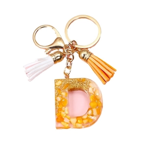 Letter D resin keychain with gold flakes, orange stones and decorative tassels