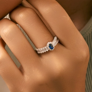 Elegant s925 silver ring featuring an oval blue gemstone and sparkling cubic zirconia stones