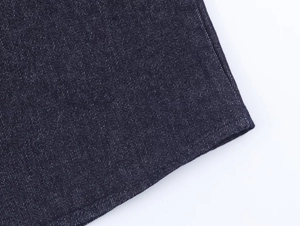 Close-up of premium dark blue denim fabric texture with detailed diagonal twill weave