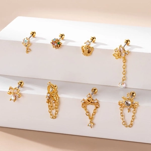 Golden stainless steel butterfly and crown stud earrings with chains and cubic zirconia