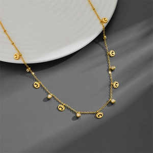 Gold plated evil eye charm necklace featuring sparkling zircons on a delicate chain