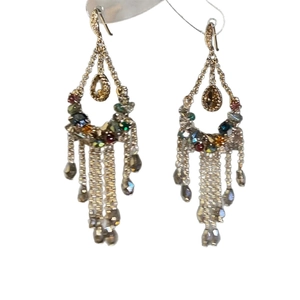 Exaggerated metal tassel earrings with colorful beads and water drop pendants on white background