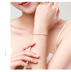 Minimalist S925 sterling silver chain bracelet with micro-pave accents on female wrist