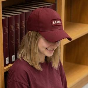 Vintage burgundy baseball cap with LA&DH embroidery and distressed brim details