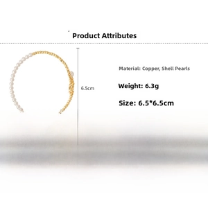 Detail of beaded bracelet featuring white pearls and golden copper faceted beads