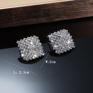 Detail view of square rhinestone earrings measuring 2.3cm by 2cm with silver pavé crystals