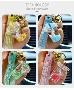 Close-up of four colorful unicorn liquid keychains with glitter and matching wrist straps